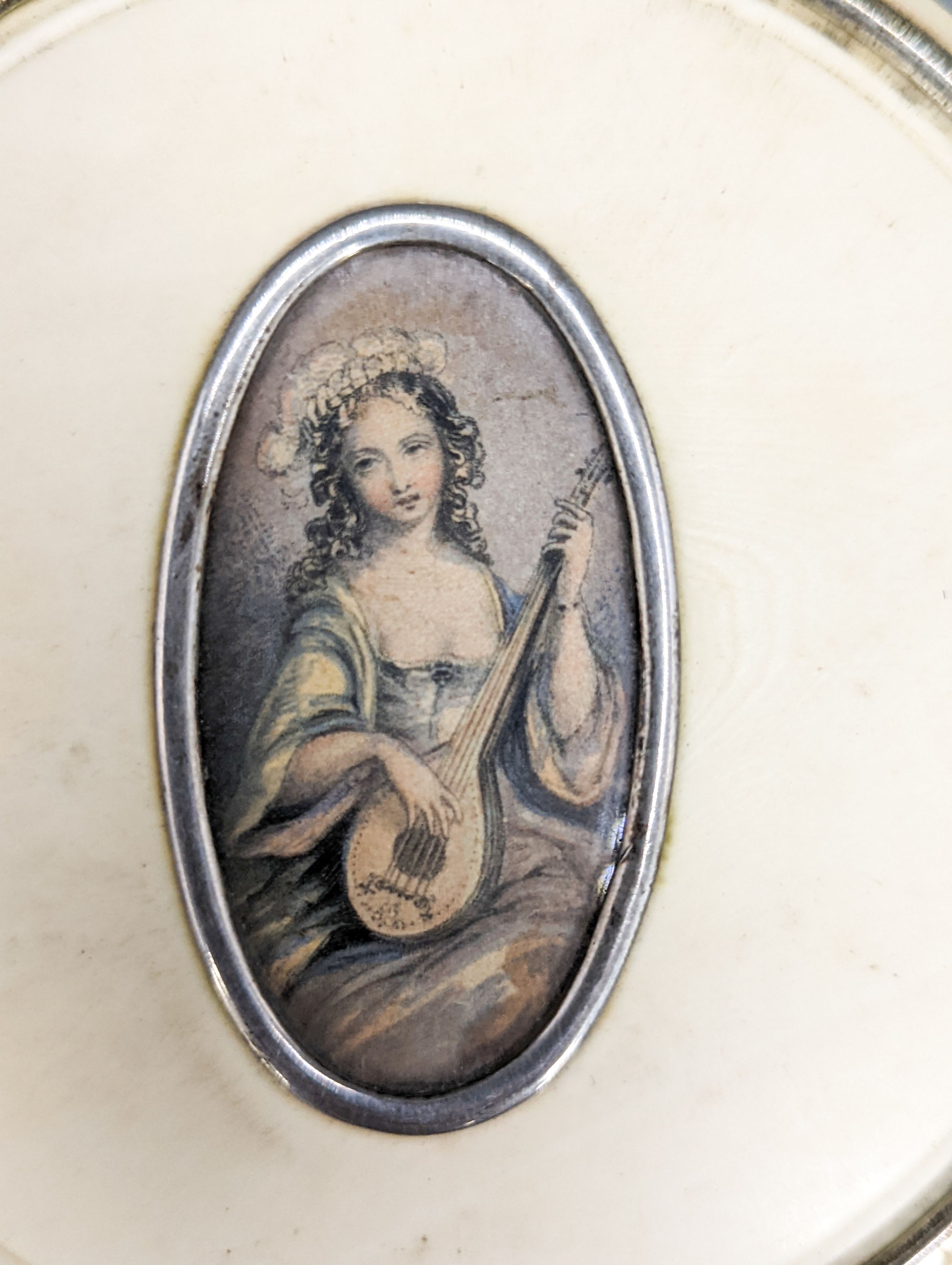 An early 19th century ivory circular box with central cartouche, a tortoiseshell match holder, diameter 9cm, and a pierced pot